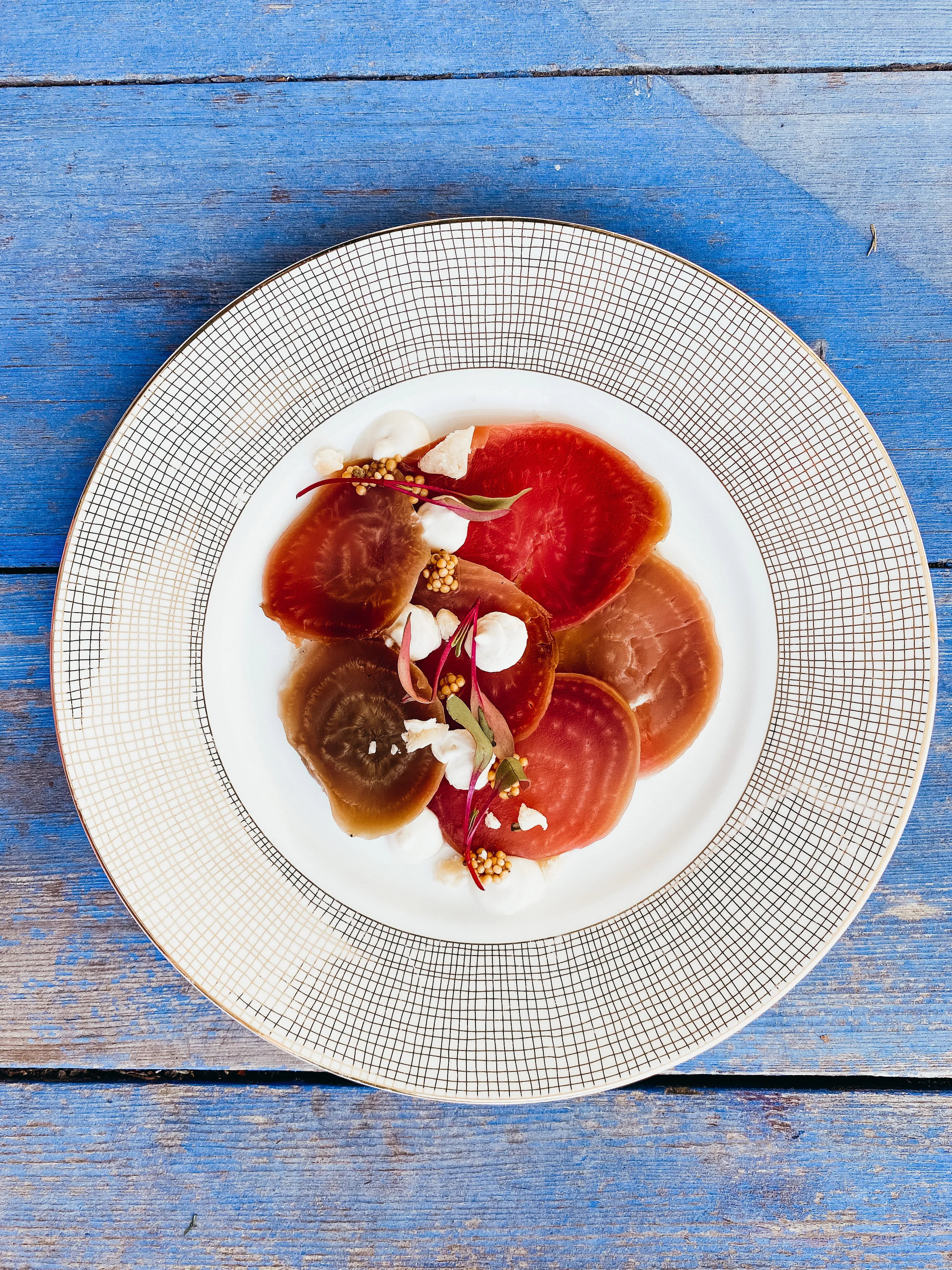 Tabletop spread with woven textures and floral accents