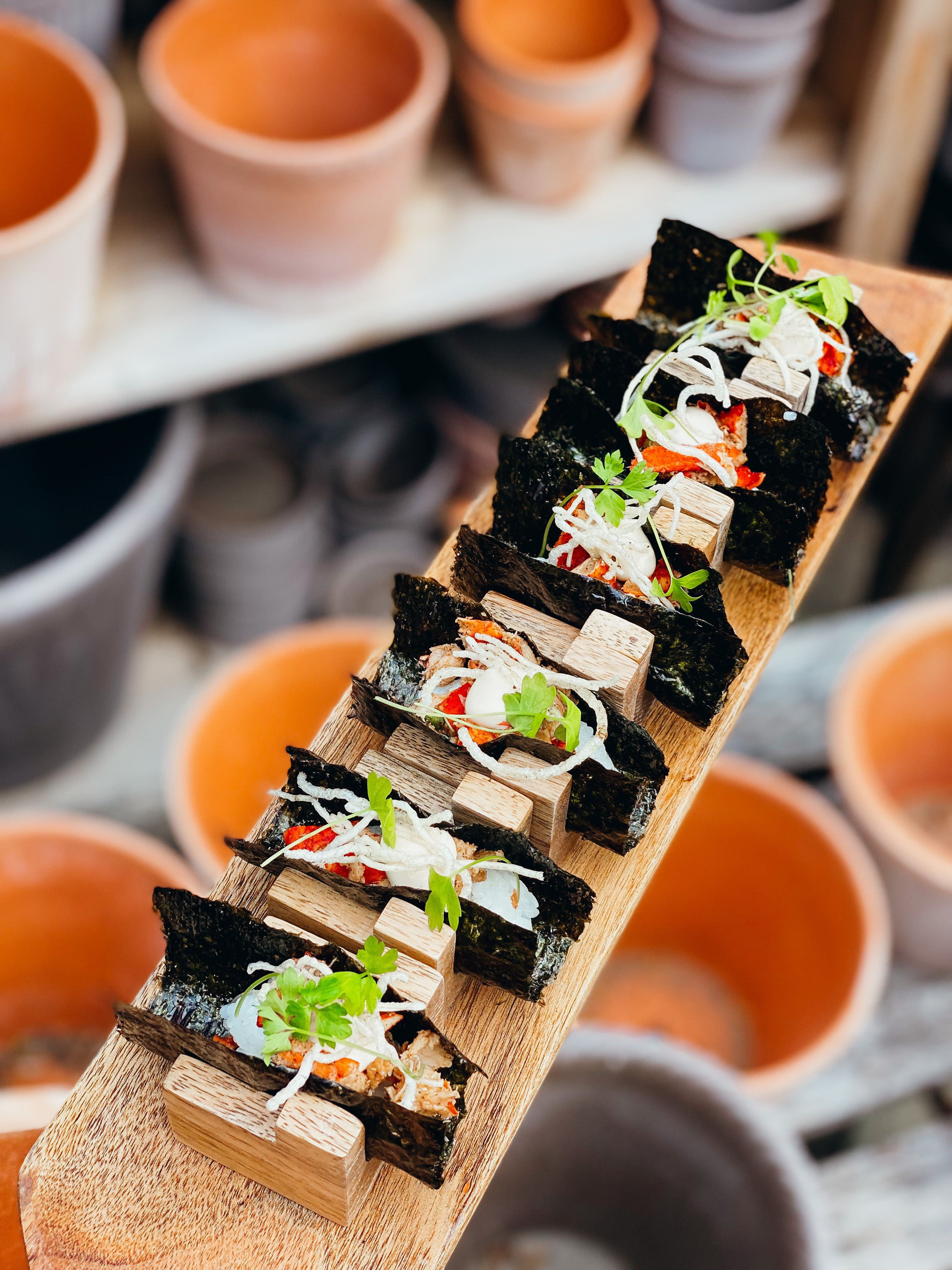 Minimal beach dining arrangement under soft coastal sky